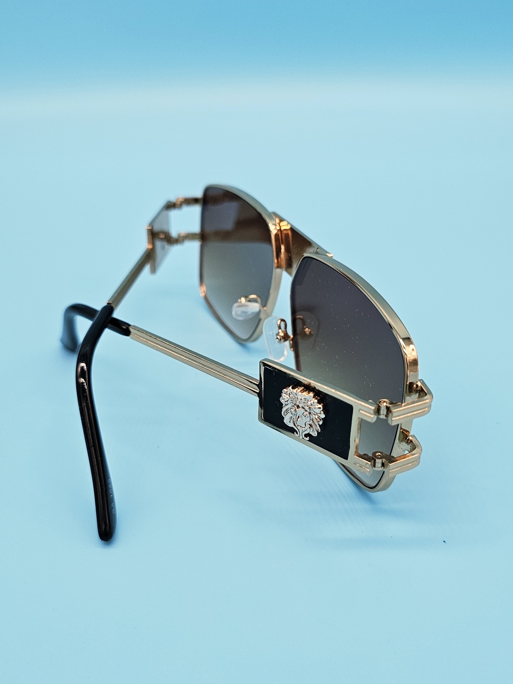 Gold and Black Men's Sunglasses with Lion Emblem